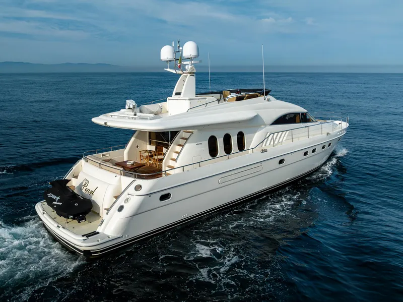 Slide: The Image of 2002 Viking Princess 72 SportCruiser yacht cruising on open water. - 5