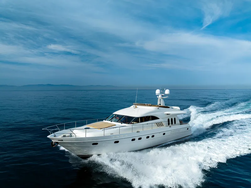 Slide: The Image of 2002 Viking Princess 72 SportCruiser yacht cruising on open water. - 8