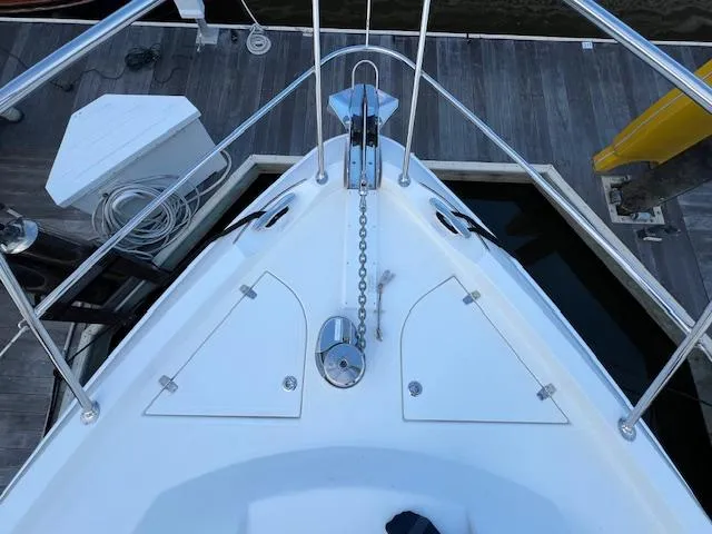 Slide: The Image of Bow view of 2020 Riviera 5400 Sport Yacht docked at marina. - 15