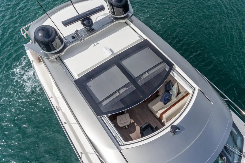 Slide: The Image of 2020 Riviera 5400 Sport Yacht, aerial view, sleek design, cruising on blue water. - 16