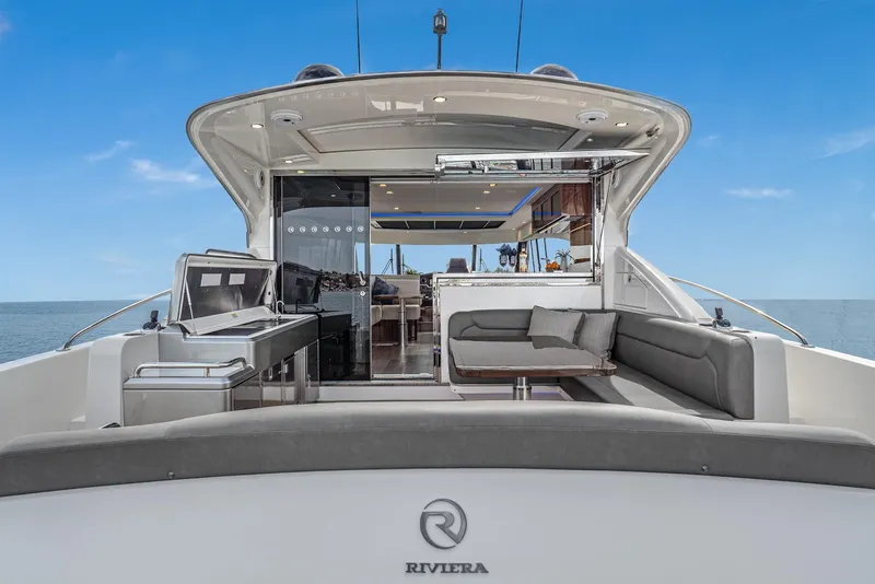 Slide: The Image of 2020 Riviera 5400 Sport Yacht with spacious deck and modern interior design. - 18