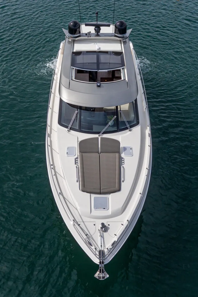 Slide: The Image of 2020 Riviera 5400 Sport Yacht cruising on open water, aerial view. - 3