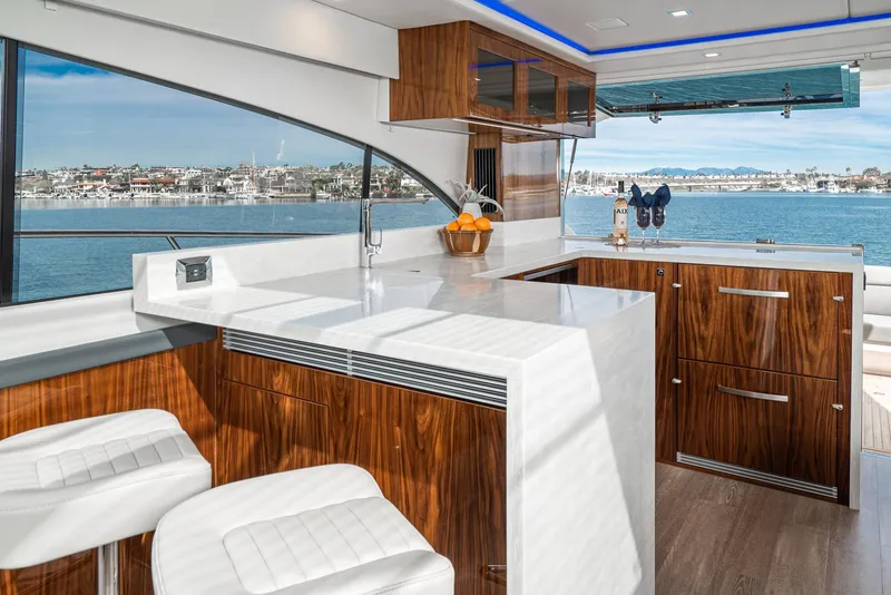 Slide: The Image of Luxurious interior of 2020 Riviera 5400 Sport Yacht with modern kitchen and ocean view. - 33