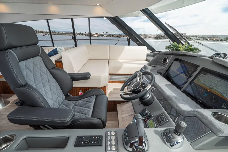 Slide: The Image of 2020 Riviera 5400 Sport Yacht interior with modern helm and luxurious seating. - 39
