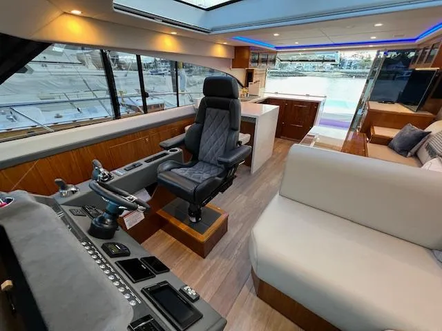 Slide: The Image of Luxurious interior of 2020 Riviera 5400 Sport Yacht with modern helm and seating area. - 43