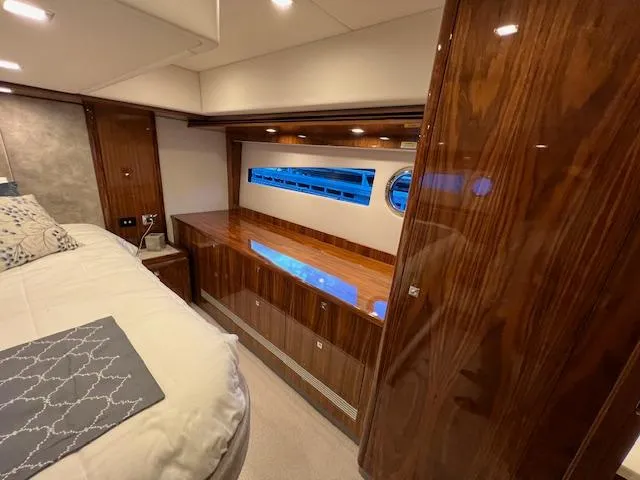Slide: The Image of Luxurious interior of 2020 Riviera 5400 Sport Yacht with polished wood and modern design. - 49