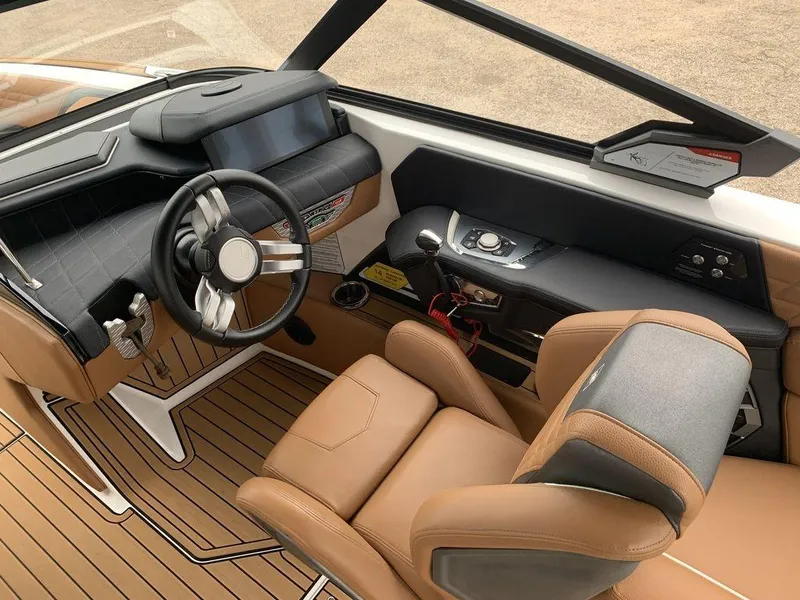 Slide: The Image of 2022 Nautique Super Air Nautique G21 cockpit with luxury seating and advanced controls. - 4