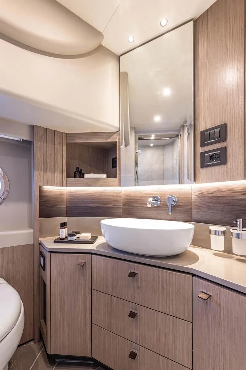Slide: The Image of Luxurious bathroom interior of 2027 Absolute 53 Navetta yacht with modern fixtures and elegant design. - 14