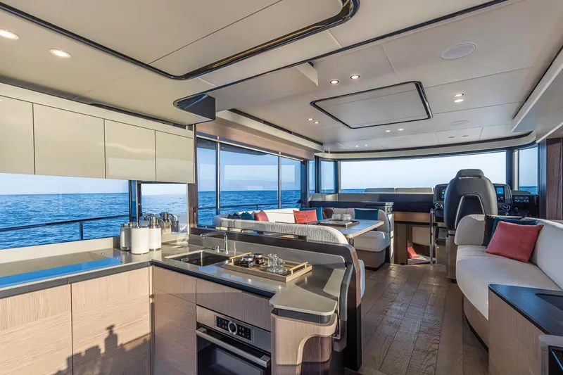Slide: The Image of Luxurious interior of 2027 Absolute 53 Navetta yacht with modern kitchen and ocean view. - 2