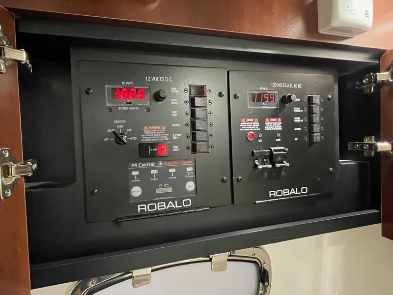 Slide: The Image of 2023 Robalo R360 Center Console electrical panel with digital displays and controls. - 8