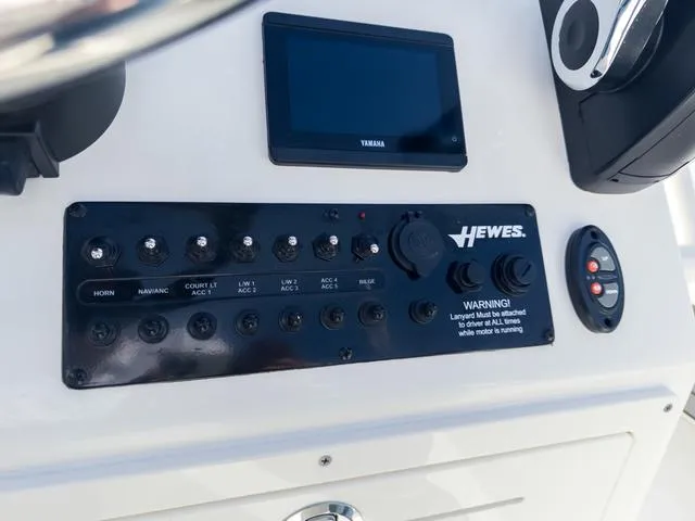 Slide: The Image of Control panel of 2024 Hewes Redfisher 18 boat with Yamaha display. - 24