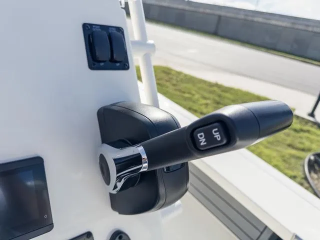 Slide: The Image of Close-up of 2024 Hewes Redfisher 18 boat throttle control lever. - 25