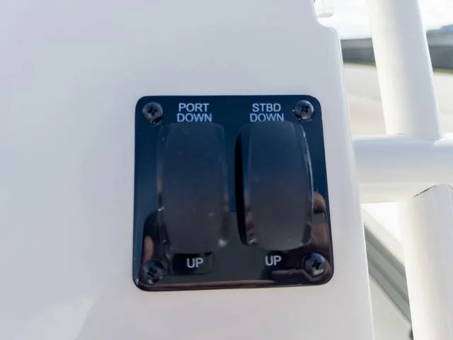 Slide: The Image of 2024 Hewes Redfisher 18 boat control panel with port and starboard switches. - 26