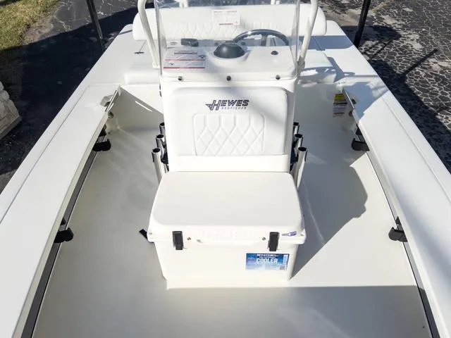 Slide: The Image of 2024 Hewes Redfisher 18 boat interior with console and cooler. - 31