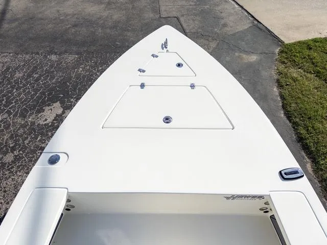 Slide: The Image of 2024 Hewes Redfisher 18 boat deck, featuring sleek design and storage compartments. - 32