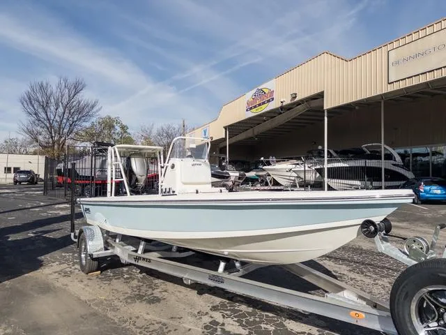 Slide: The Image of 2024 Hewes Redfisher 18 boat on trailer outside dealership. - 5