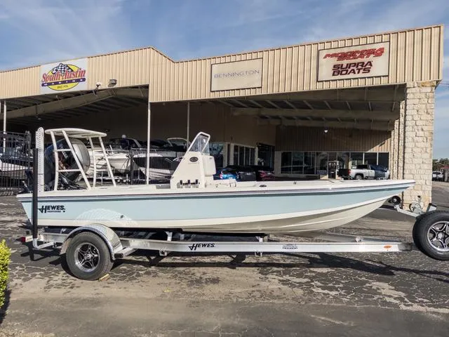 Slide: The Image of 2024 Hewes Redfisher 18 boat on trailer outside dealership. - 6