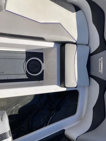 Slide: The Image of 2016 Supra SA 400 boat interior with cushioned seating and logo. - 21