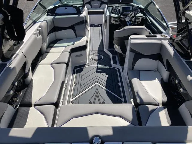 Slide: The Image of 2016 Supra SA 400 boat interior with luxurious seating and modern dashboard. - 7