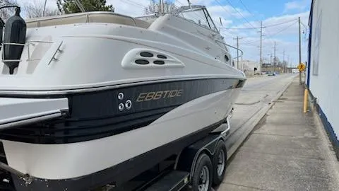 Slide: The Image of 2001 Ebbtide 2500 Mid-Cabin Cruiser on trailer, side view. - 1