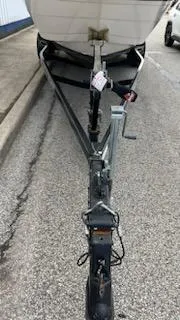 Slide: The Image of 2001 Ebbtide 2500 Mid-Cabin Cruiser on a trailer. - 10