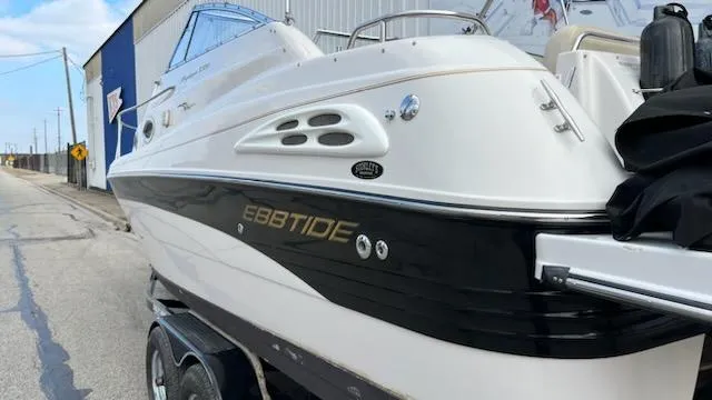 Slide: The Image of 2001 Ebbtide 2500 Mid-Cabin Cruiser boat on trailer, side view. - 8
