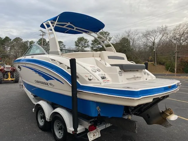 Slide: The Image of 2018 Chaparral 224 Sunesta boat on a trailer, rear view with blue accents. - 11