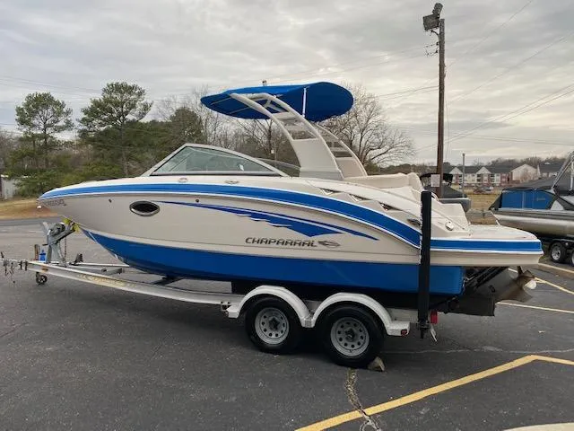 Slide: The Image of 2018 Chaparral 224 Sunesta boat on a trailer in a parking lot. - 12