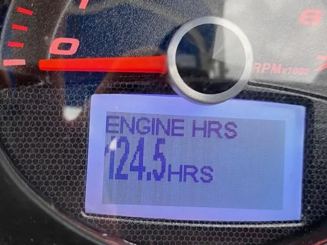 Slide: The Image of Close-up of 2018 Chaparral 224 Sunesta engine hours display showing 124.5 hours. - 14
