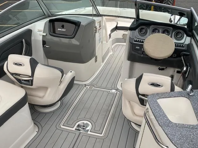 Slide: The Image of 2018 Chaparral 224 Sunesta boat interior with seating and dashboard. - 15
