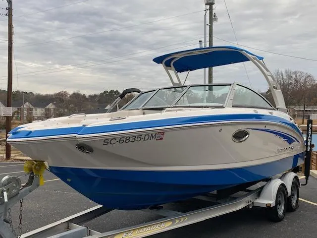 Slide: The Image of 2018 Chaparral 224 Sunesta boat on trailer with blue and white exterior. - 2