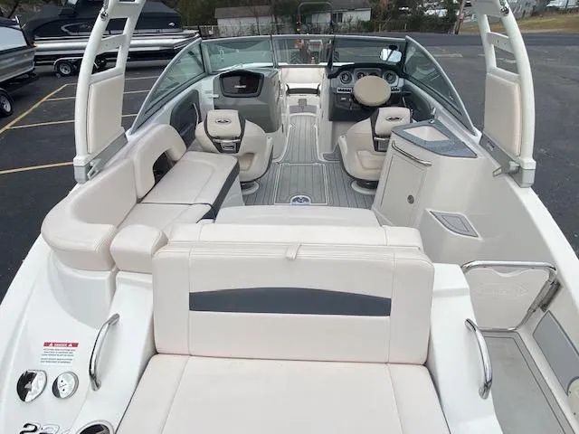 Slide: The Image of 2018 Chaparral 224 Sunesta boat interior with white seating and modern dashboard. - 20