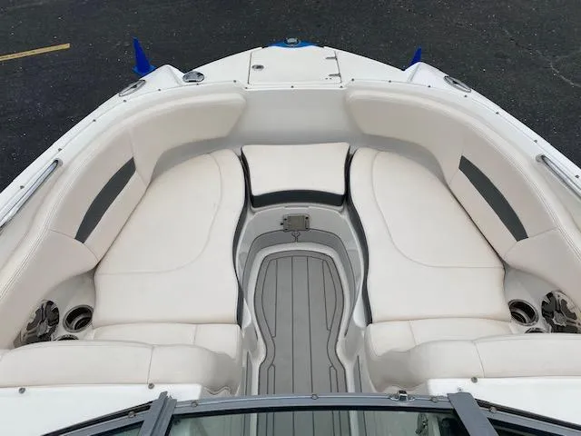 Slide: The Image of 2018 Chaparral 224 Sunesta boat with spacious white seating and gray flooring. - 23