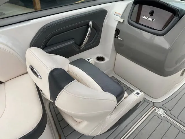 Slide: The Image of 2018 Chaparral 224 Sunesta boat interior with white and black seating. - 25
