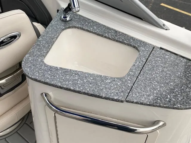 Slide: The Image of 2018 Chaparral 224 Sunesta boat sink with granite countertop and faucet. - 27