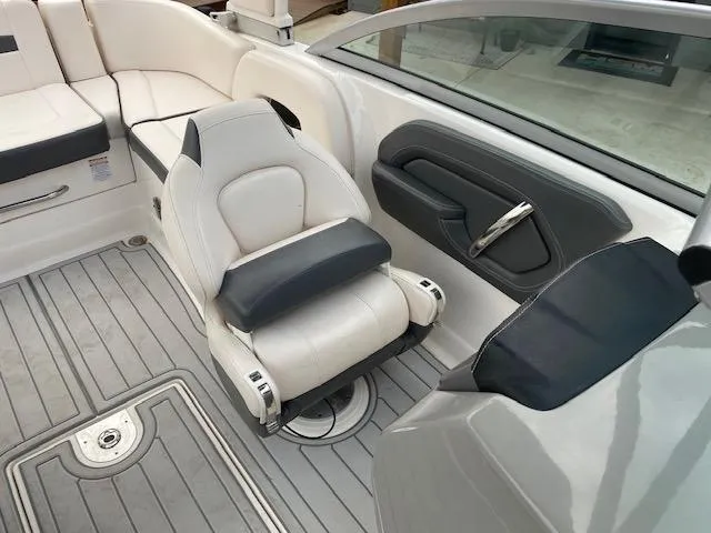 Slide: The Image of 2018 Chaparral 224 Sunesta boat interior with white and gray seating. - 29