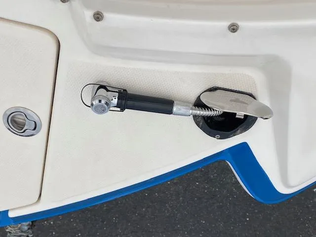 Slide: The Image of Fuel cap and filler neck of a 2018 Chaparral 224 Sunesta boat. - 33