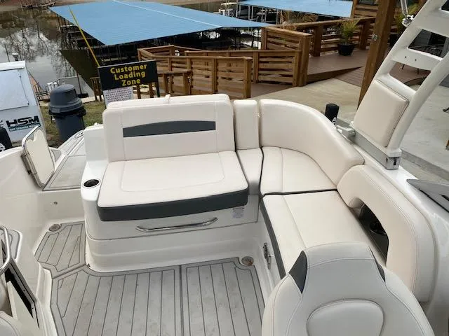 Slide: The Image of 2018 Chaparral 224 Sunesta boat with spacious seating area at dock. - 37