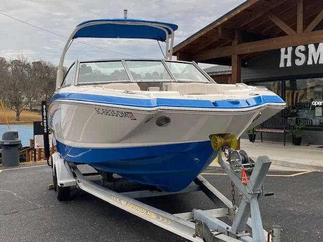Slide: The Image of 2018 Chaparral 224 Sunesta boat on trailer outside dealership. - 5