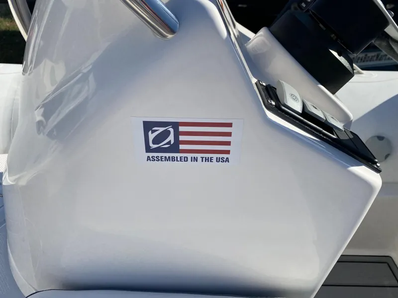 Slide: The Image of 2024 Zodiac Yachtline 440, assembled in the USA, close-up of control panel. - 12