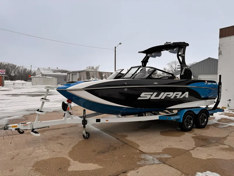 Slide: The Image of 2021 Supra SR boat on trailer in snowy outdoor setting. - 5