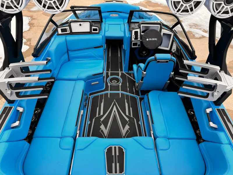 Slide: The Image of 2021 Supra SR boat interior with blue seating and advanced dashboard. - 7