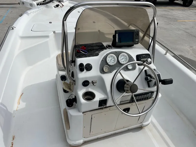 Slide: The Image of 2001 Fishmaster 19 boat console with steering wheel, gauges, and navigation equipment. - 3