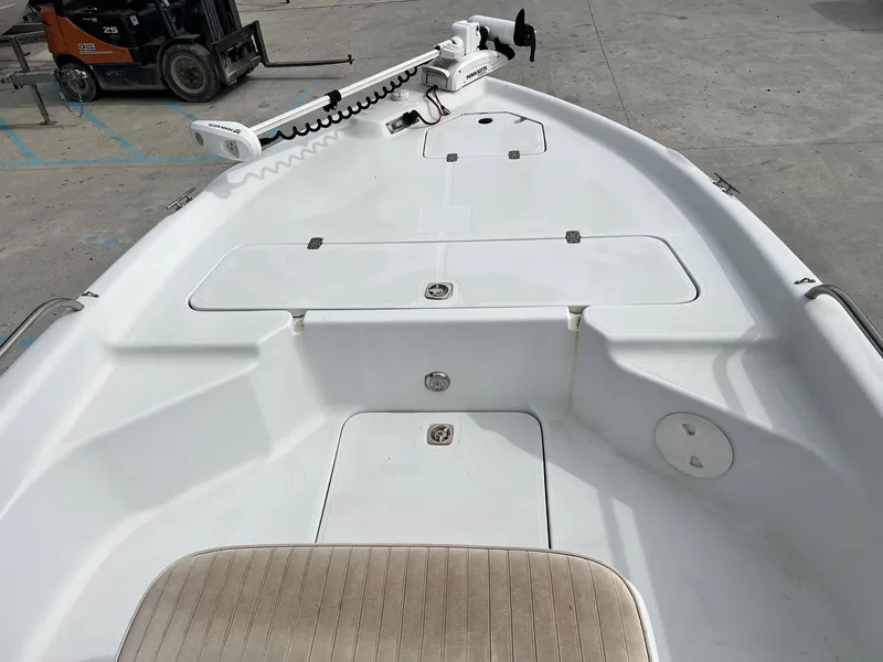 Slide: The Image of 2001 Fishmaster 19 boat deck with storage compartments and trolling motor. - 6