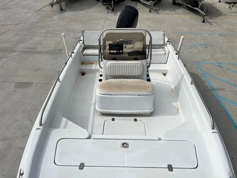 Slide: The Image of 2001 Fishmaster 19 boat interior with seating and console. - 7