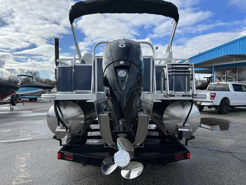 Slide: The Image of 2024 Avalon 2385 25 LSZ Fish RF pontoon boat rear view with outboard motor. - 11