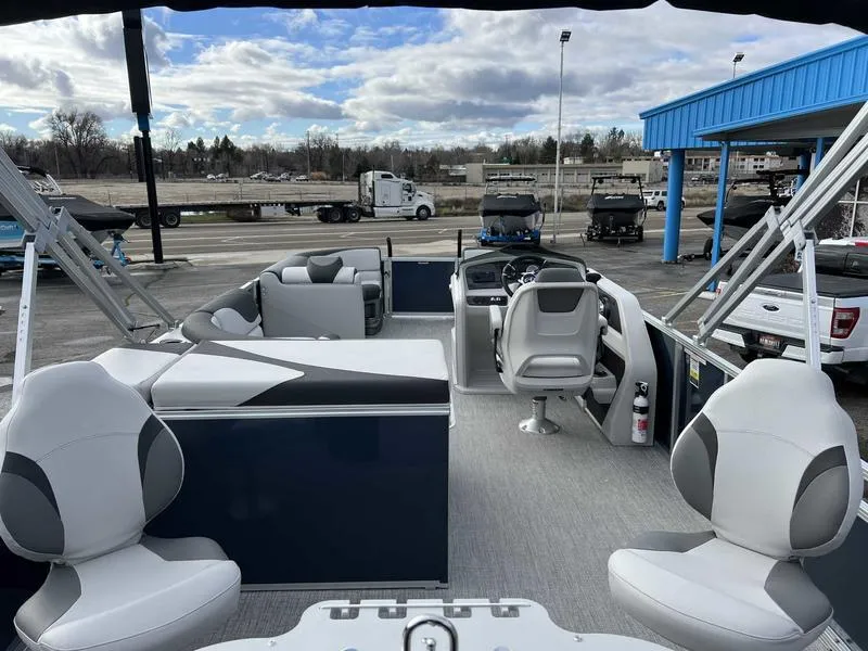 Slide: The Image of 2024 Avalon 2385 25 LSZ Fish RF pontoon boat interior with seating and helm. - 3