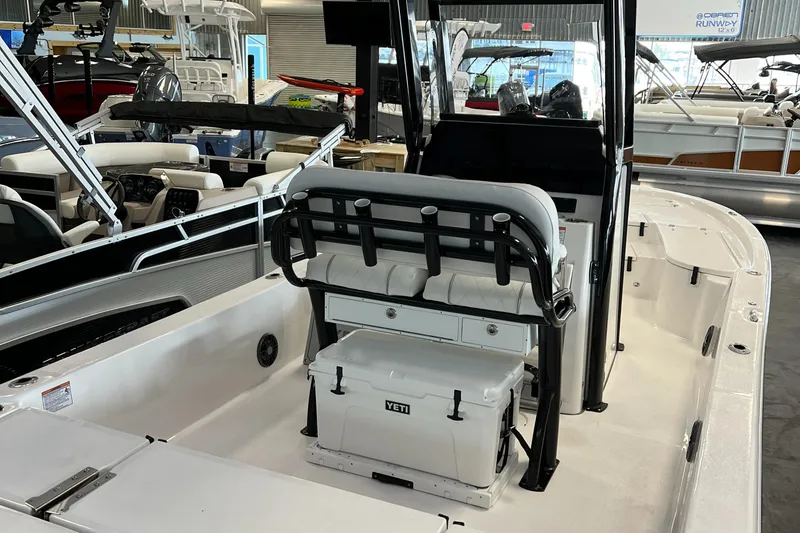 Slide: The Image of 2024 Sea Fox 251 Bay boat interior with seating and Yeti cooler. - 3