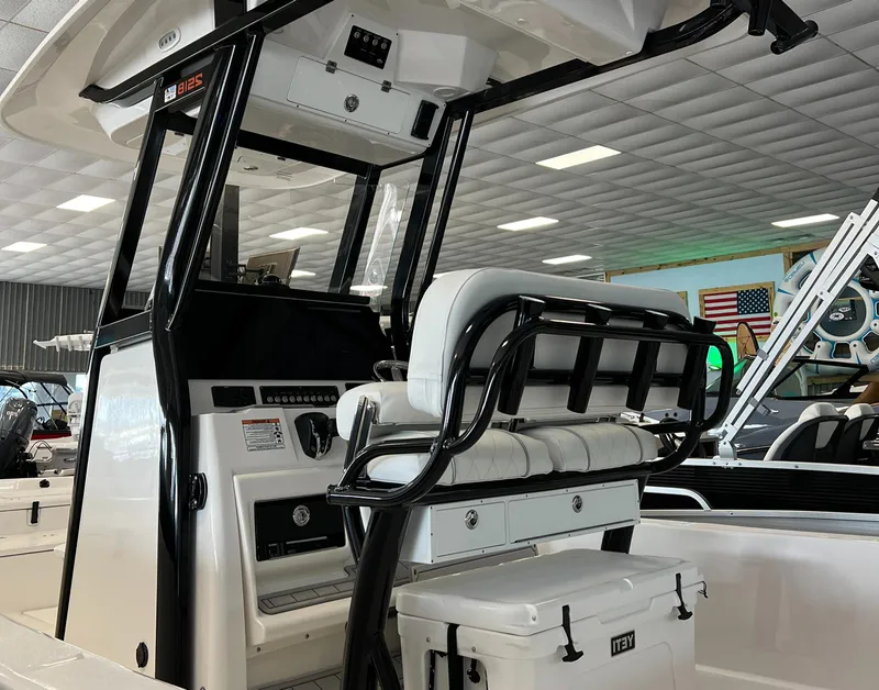 Slide: The Image of 2024 Sea Fox 251 Bay boat interior with helm station and seating. - 4