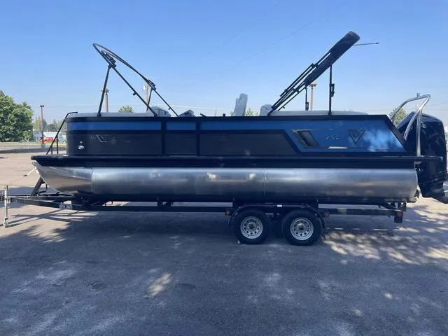 Slide: The Image of 2022 Viaggio D23U pontoon boat on a trailer in a parking lot. - 5